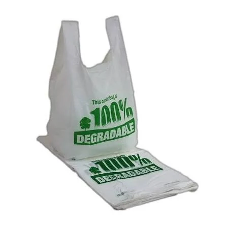 White T-shirt-style carry bag and a stack of matching bags with green printed lettering