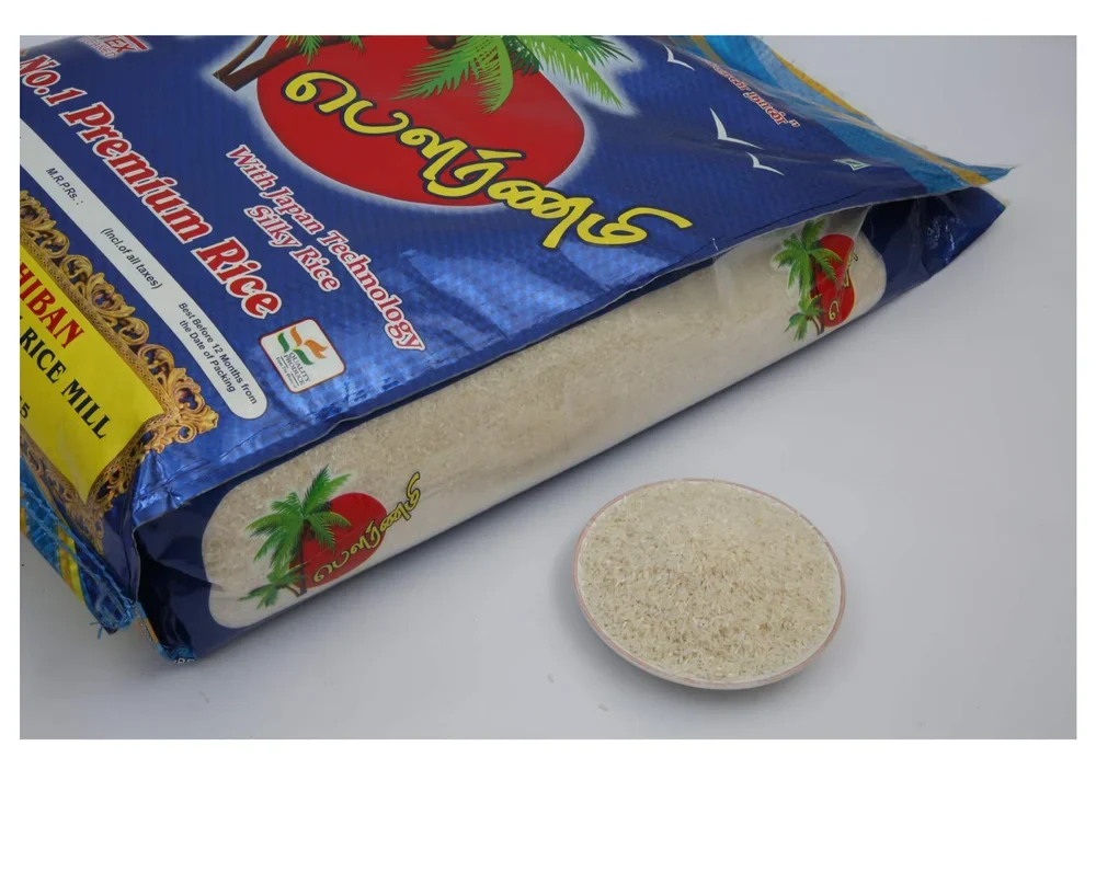 Blue printed premium rice bag with a clear side panel beside a bowl of white rice